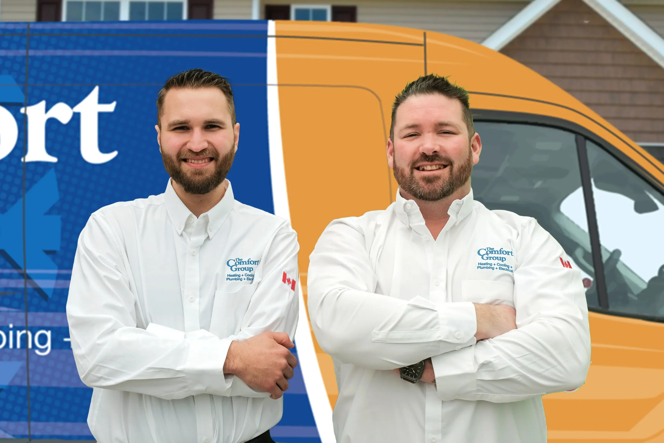 Two The Comfort Group technicians smiling in front of their green service van, wearing issued jackets during an on-site consultation.