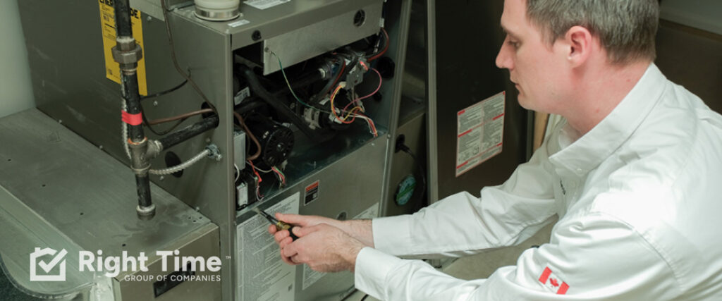HVAC technician adjusting furnace valve with wrench on Vancouver Island, diagnosing why furnace runs too long in mild weather conditions