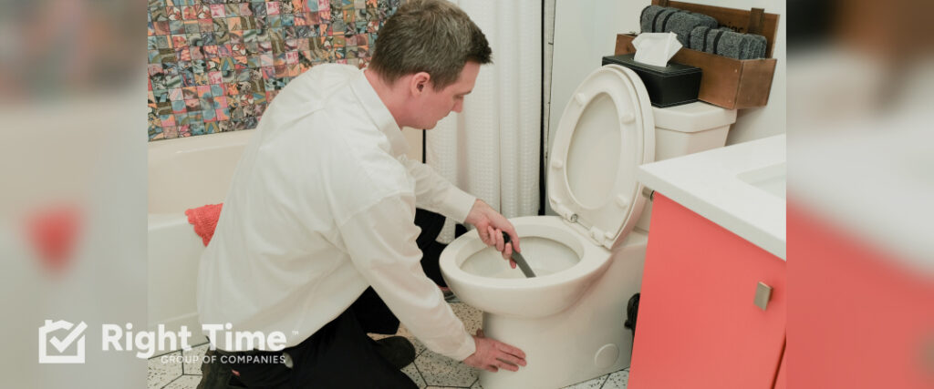 Emergency plumber addressing an overflowing toilet in a Victoria home.